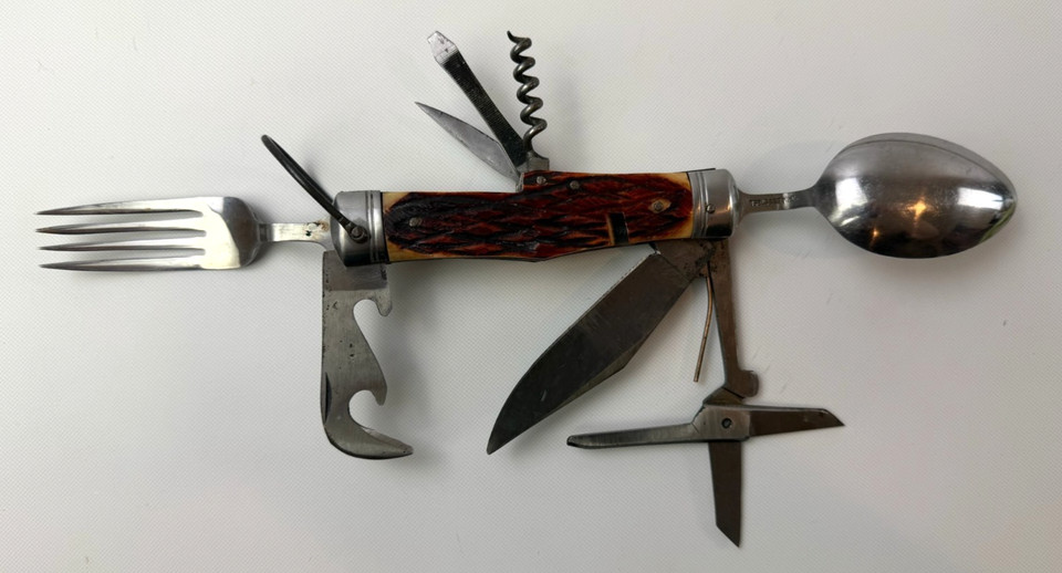 A Victorian-style hobo multi-tool with folding spoon, fork, and knife — the original camping Swiss Army knife before that was even a thing.