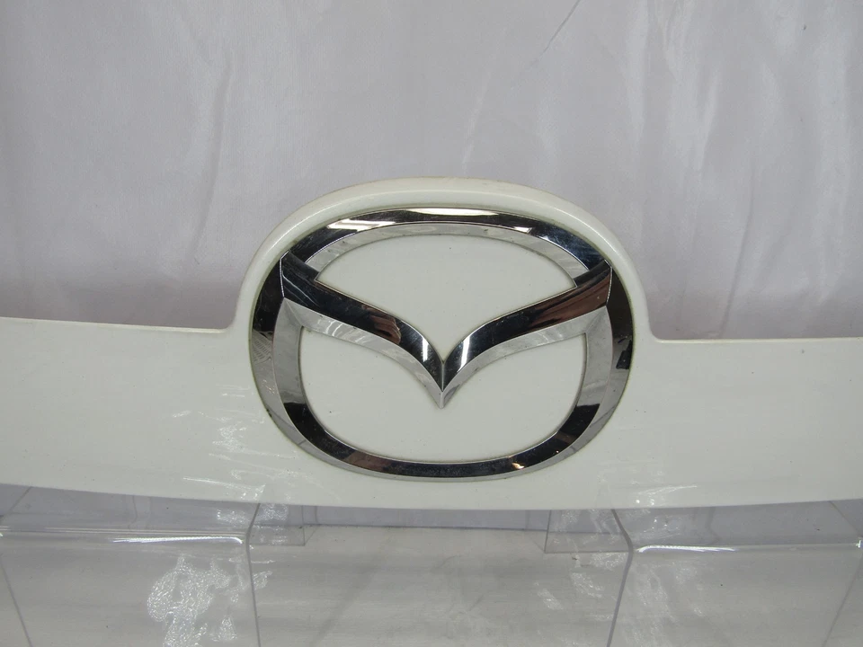 Mazda CX-7 2007-2009 puerta levadiza trasera acabado panel emblema insignia EG21-50811 OEM Foto 3 de 4