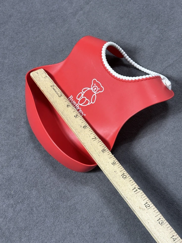 Babero Baby Bjorn Food Catching Silicona Rojo con Borde de Cuentas Blanco Bolsillo Profundo Foto 3 de 4