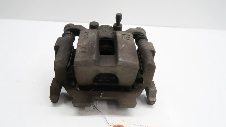 Pinza de freno trasera izquierda Nissan Quest 2011-2017 OEM Foto 2 de 4