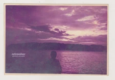 Unusual Purple Photo Silhouette of Man by the Sea with Clouds in Surreal Scene