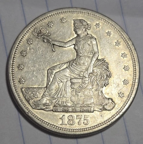 1875 S U.S. TRADE DOLLAR. NICE OVERALL  EXAMPLE HAS LUSTER IN PROTECTED AREAS...