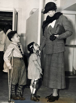 Mrs. Franklin D. Roosevelt Is Seen Here With Two Tiny Sufferers Fr- Old Photo