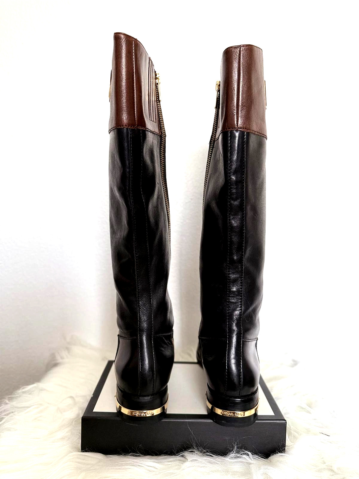 women's Michael Kors Hayley two-toned black and brown leather riding boots