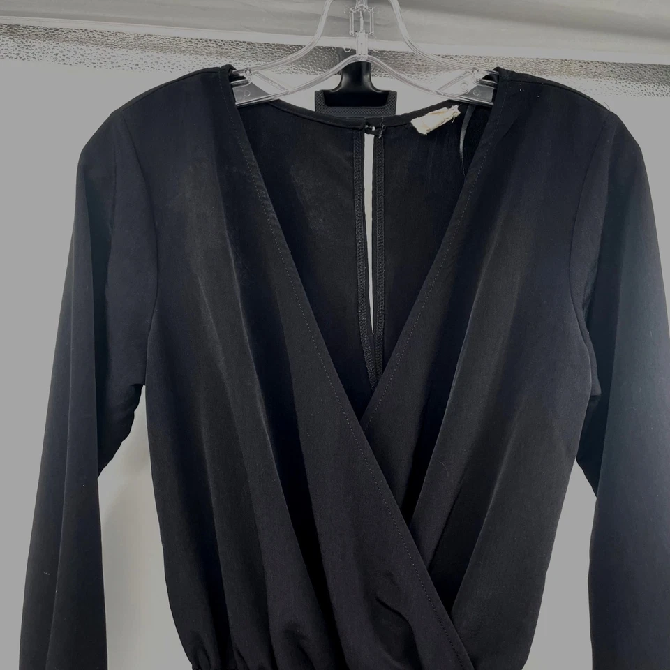 One Clothing Mujer Mameluco Negro Manga Larga Cuello en V Bolsillos con Cremallera Talla Pequeña Foto 2 de 4