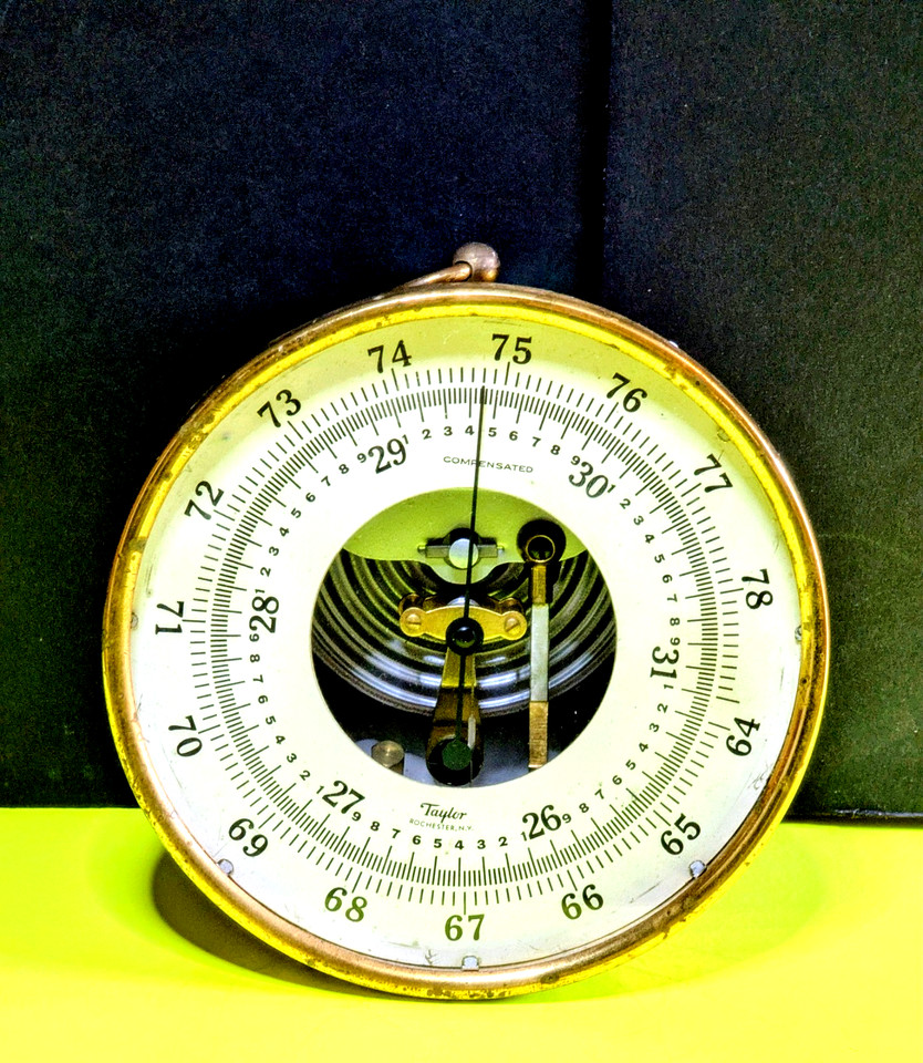 A rare Taylor compensated aneroid barometer with an original Michigan Conservation Department tag — a genuine piece of scientific and bureaucratic history you can hang on a wall.