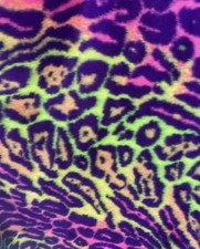 Multi colored Leopard Spotted shaggy short pile faux fur fabric by the yard
