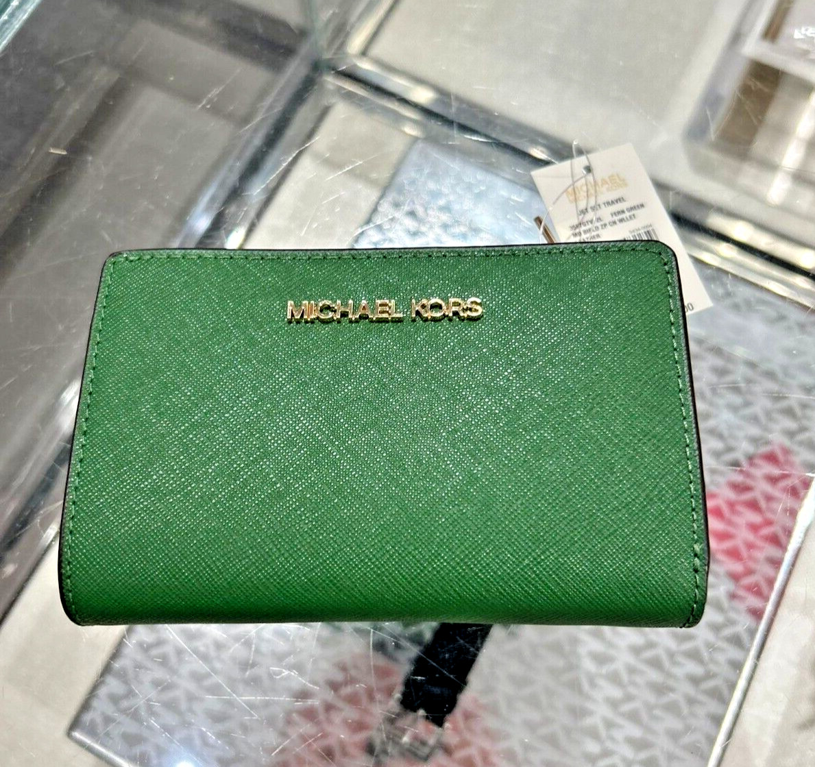 Green michael kors wallet hotsell