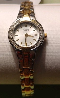 Vintage Gold And Silver Toned Pulsar Lady's Watch With Rhinestones Around Face.