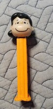vintage PEZ Candy Dispenser Peanuts Lucy Orange Base Slovenia