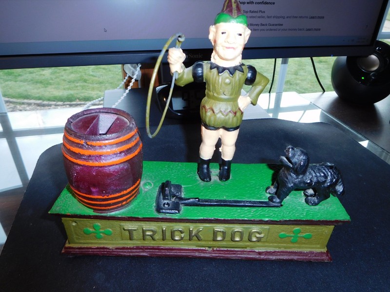 Vintage cast iron "Trick Dog" bank. Made in Taiwan.