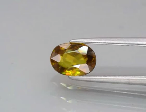 SPHENE 0.98 ct Greenish Yellow Super Raimbow Sparkles Oval 7.2x5.3x3.1mm Natural - Picture 4 of 24
