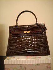 Borsa molto elegante, lunga 28 cm. in VERO coccodrillo baby, non stampata.