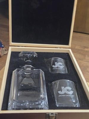 Whiskey set including a glass decanter and two glasses.