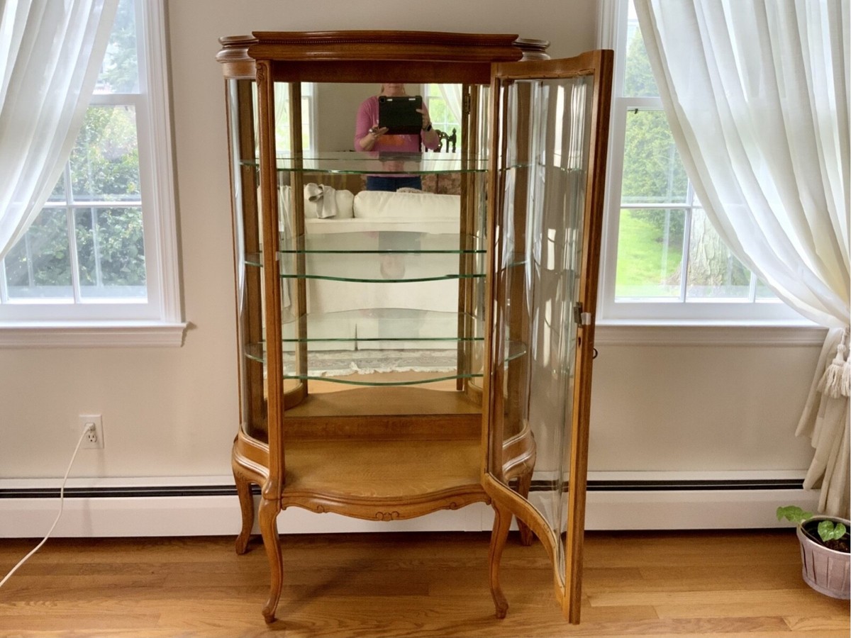 Early 20th Century Victorian Carved Oak Bow-Front Lighted Curio