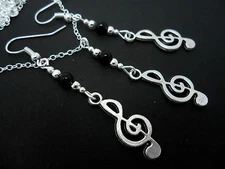 A TIBETAN SILVER MUSICAL NOTE TREBLE CLEF THEMED NECKLACE/EARRING SET. NEW.