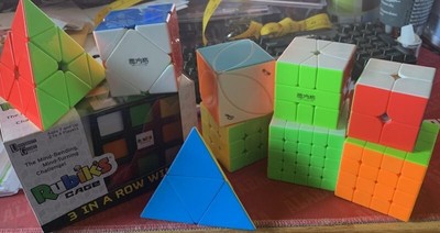 Rubik's Cube Lot of 9 Magic Twisty Cubes and a Rubik's Cage Game