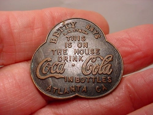 Vintage metal Betty Says Drink Coca-Cola Free Bottle TOKEN L.A. Stamp Coke