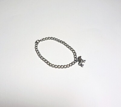 Silver curb-link bracelet with a heavy hallmarked ram charm attached  Aries/farm