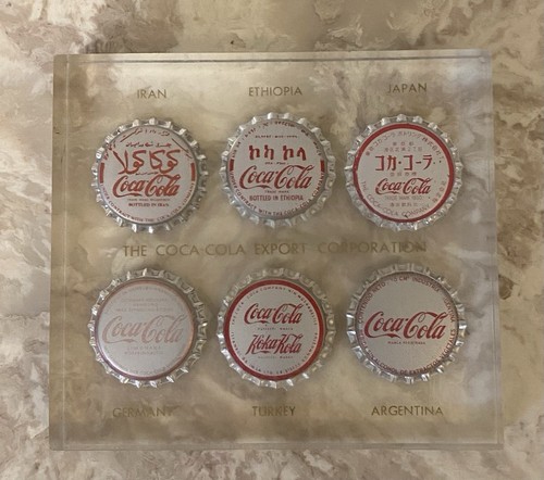 Clear Coca-Cola Export Corporation Paperweight 6 International Coke Bottle Caps