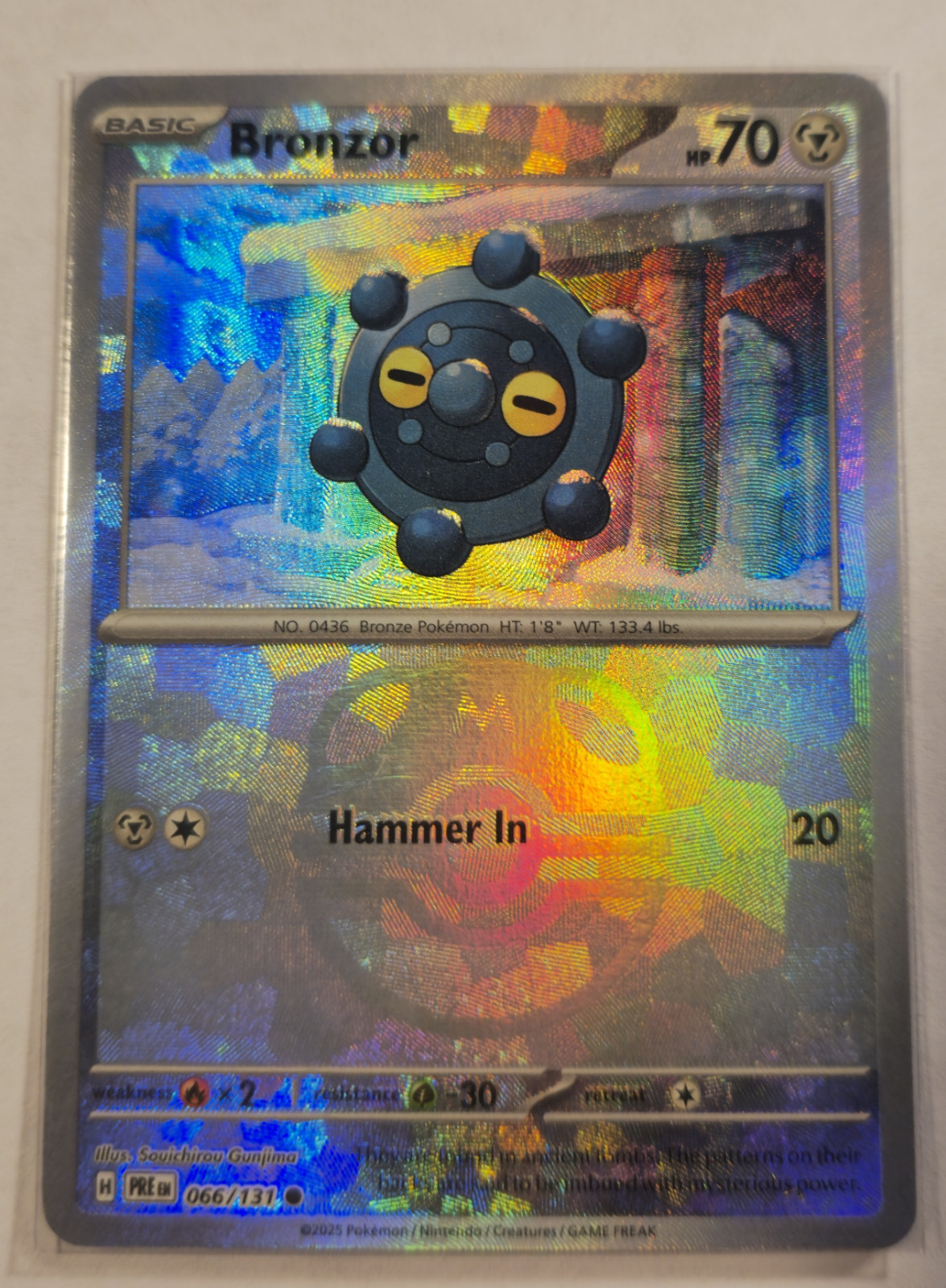 Pokemon TCG Bronzor (Master Ball Pattern) 066/131 Prismatic Evolutions Holo MINT