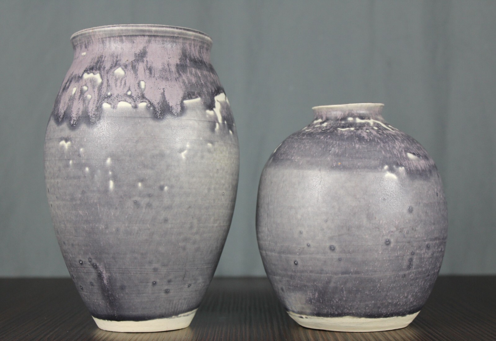 Signed KW ? two purple drip glaze studio pottery vases, unknown potter