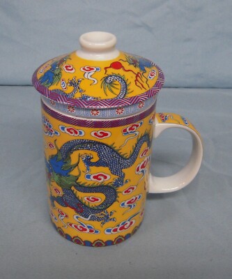 Long Yi Ceramic tea cup with lid and infuser.