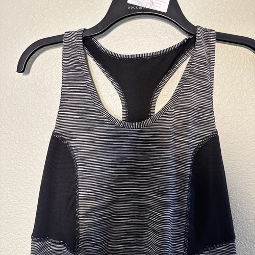 Xersion women’s Razer back Essential Performance Tank Size Med Tall Color Black
