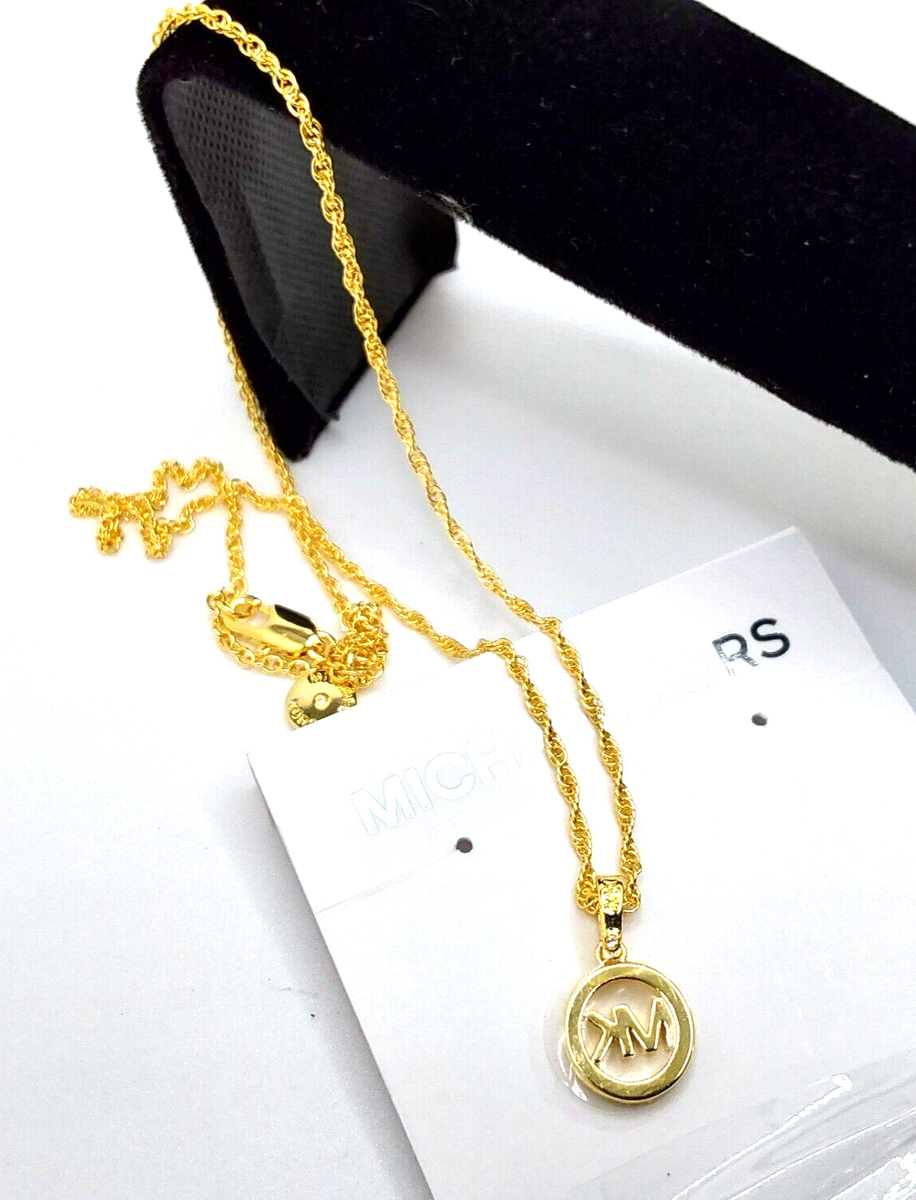 Michael Kors Elegant Gold Crystal Paved Logo Pendant