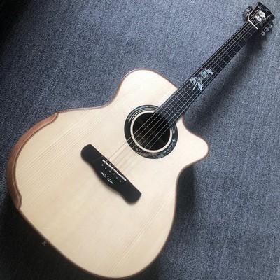 High-quality acoustic guitar with inlay patterns on the fretboard