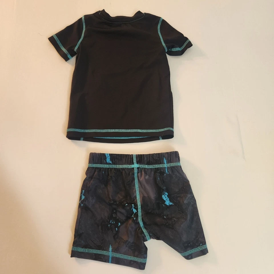 Juego de natación Jumping Beans para niños velocidad brillante 24M negro y azul protector contra erupciones y pantalones cortos Foto 3 de 4