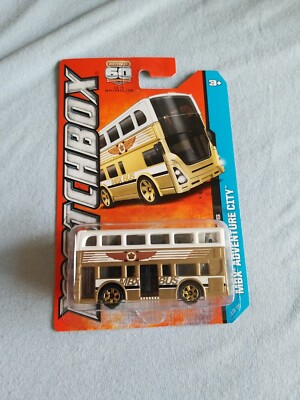 2013 Matchbox TWO-STORY BUS Gold White 1/120 GREAT CARD Adventure City