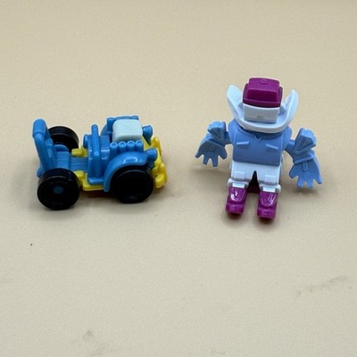 Kinder Joy Egg Toy Vehicle blue/yellow 1'' T x 1.5'' L  & Skier 1.5  X 1.5  X 1.5 