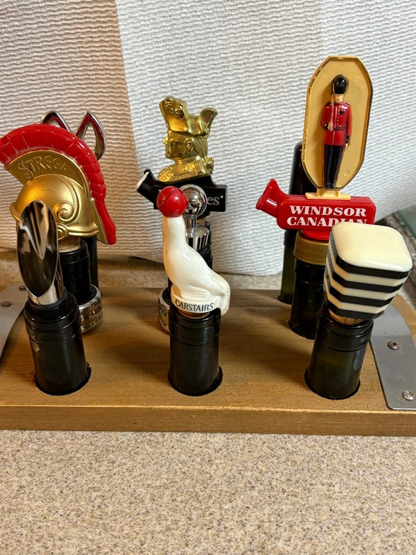 Lot of Nine Liquor Bottle Pourers w/ Glass Bottle Holders in Wooden Display Base