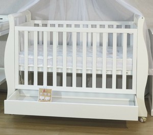 baby cots attached to bed