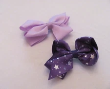 NWOT SET OF 2 GIRL'S BOWS WITH SILVER CLIPS-LIGHT PURPLE & DARK PURPLE W/ STARS