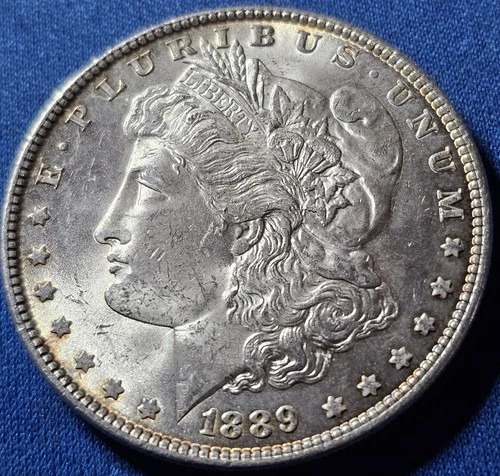 A 1889 BU Morgan Silver Dollar.  Nice Coin!