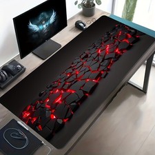 A Large Gaming Mouse Pad Featuring a Black An...