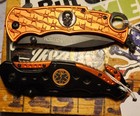 2- ORANGE KNIVES, SKULL, BARBED WIRE, & EMT- EMS BADGE, 2X W/ASSISTED OPENING. — photo 7