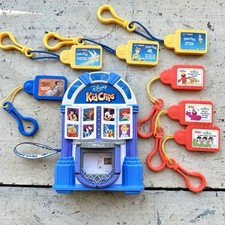 TIGER Disney Tunes Kid Clips 2002 Radio Audio Player w/7 Song Tunes Cartridges