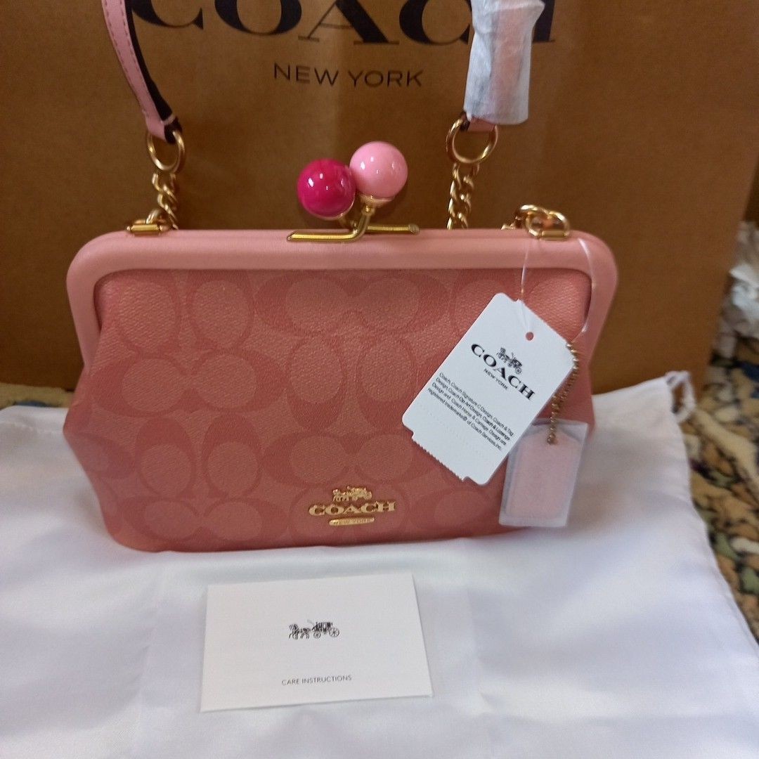 COACH signature pink chain shoulder bag with clasp closure