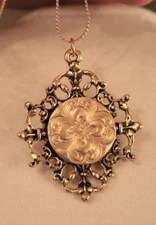 Shiny Filigree Maltese Flower Petal Twist Knot Round Goldtone Pendant Necklace