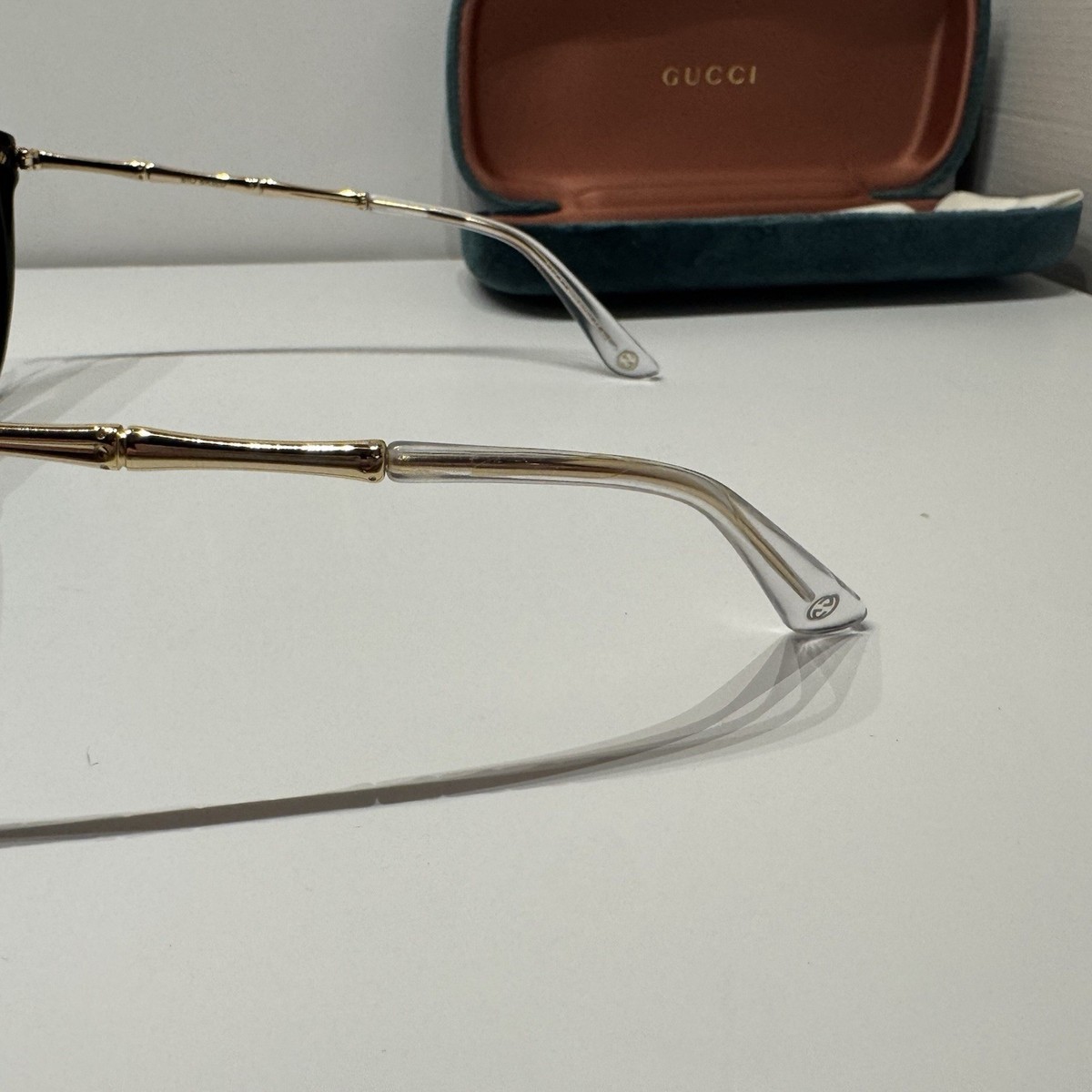 Gucci Black Cat-Eye Glasses with Gold Temples Gucci black and gold sunglasses featuring a cat-eye frame  main image 3