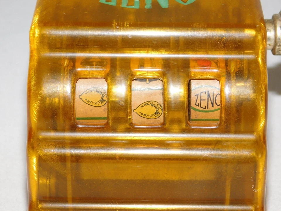 VINTAGE TRADE STIMULATOR 3 1/4" HIGH ZENO TOY SLOT MACHINE  - Image 2 of 4