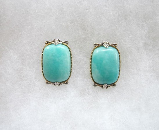 TURQUOISE  AND STERLING POST EARRINGS WITH  ELABORATE BEZEL  NORMAN HONIE ?