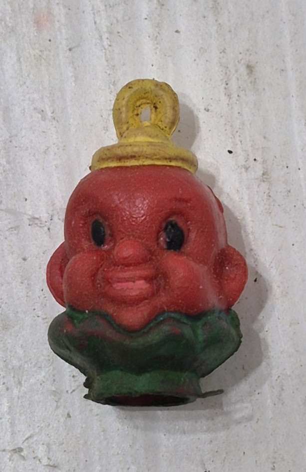 A vintage vending machine pencil topper charm — tiny, strange, and a perfect artifact of the lost world of 25¢ capsule toys that kids obsessed over.