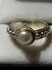 Size 7.5. Sterling Silver Simulated Pearl Ring Surrounded Filigree Design