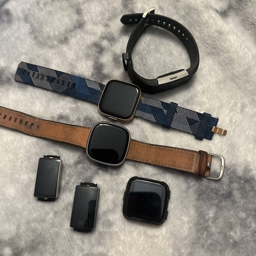 Lot of FITBIT Activity Trackers (UNTESTED) for Parts Or Repair
