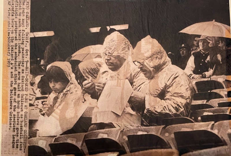 AP PHOTO OF RAIN-SOAKED OAKLAND A's FANS DURING THE 1973 PLAYOFFS