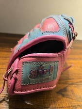 Used Girl T Ball Glove by Wilson. 10"A2446 pink and turquoise.